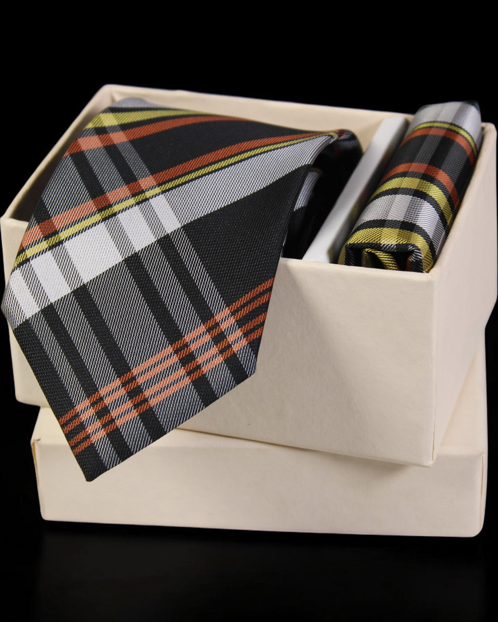 Plaid tie and pocket square set in a box on a black background Tie Benon