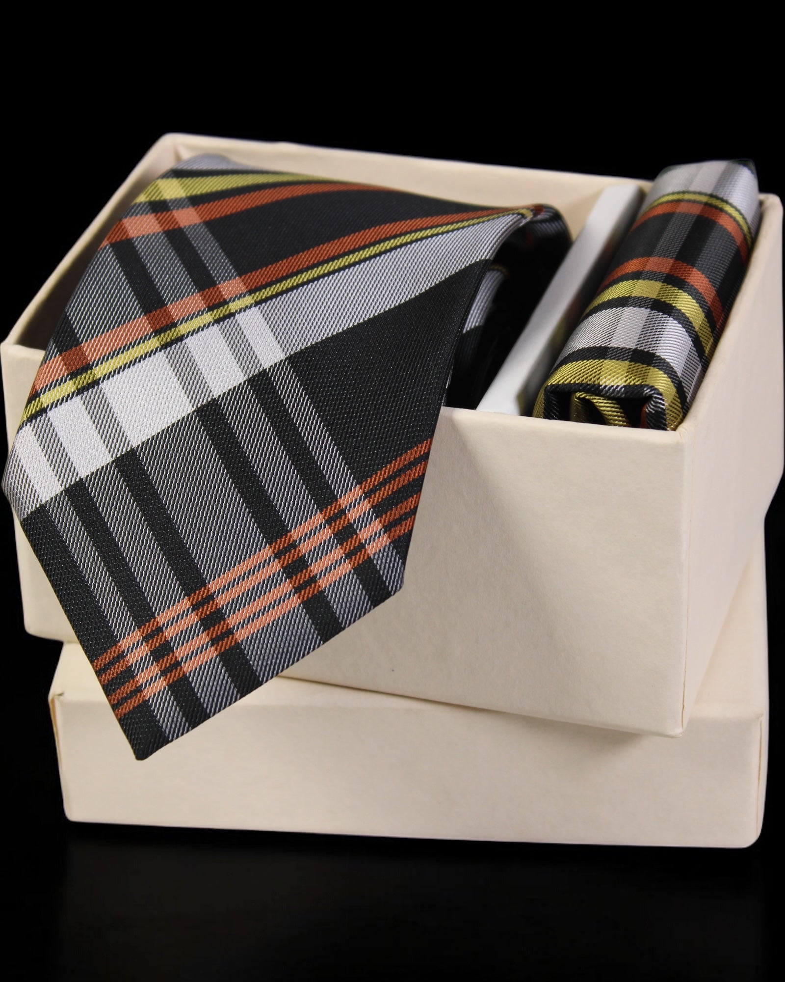 Plaid tie and pocket square set in a box on a black background Tie Benon