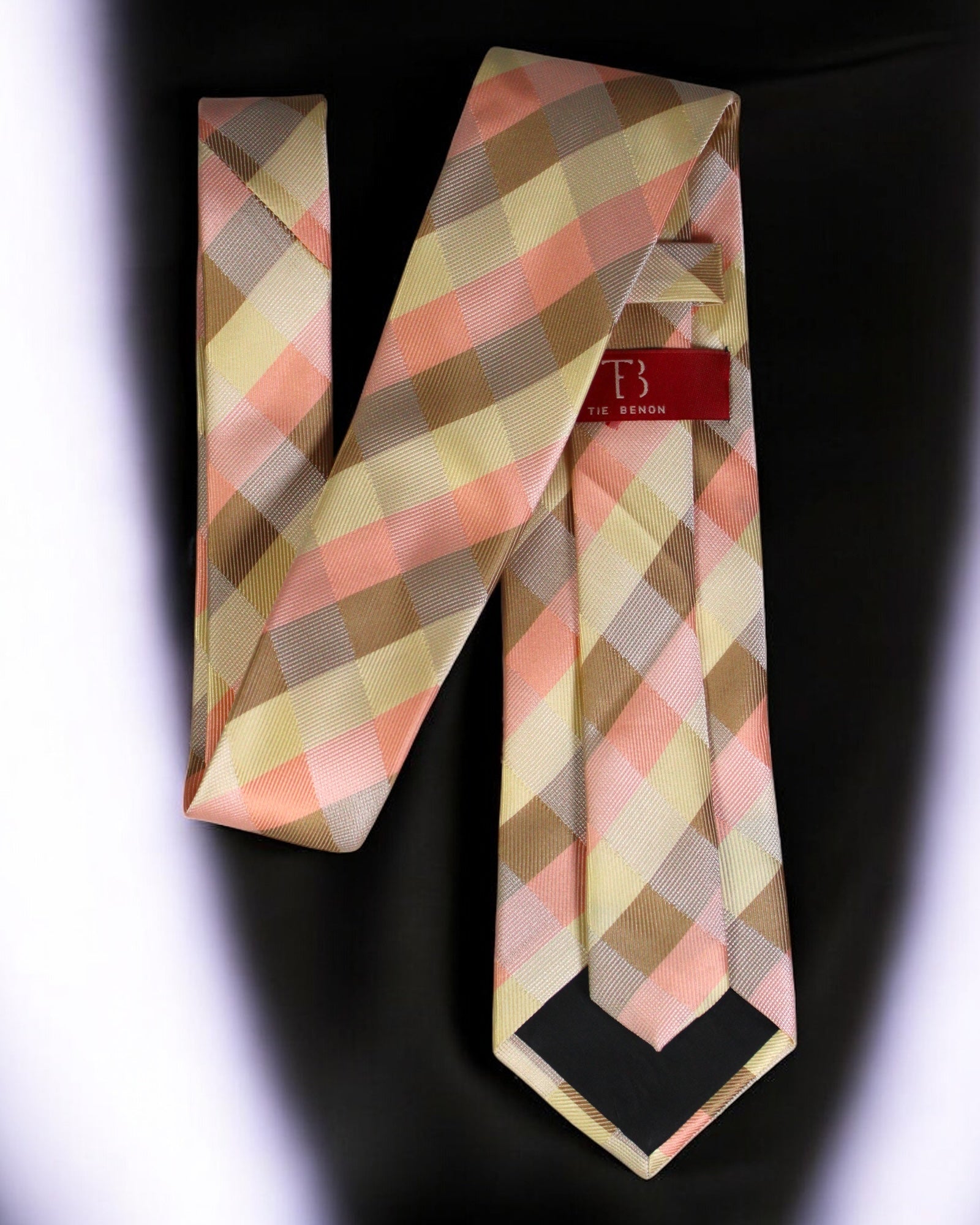 Plaid tie with a visible brand label on a dark background Tie Benon
