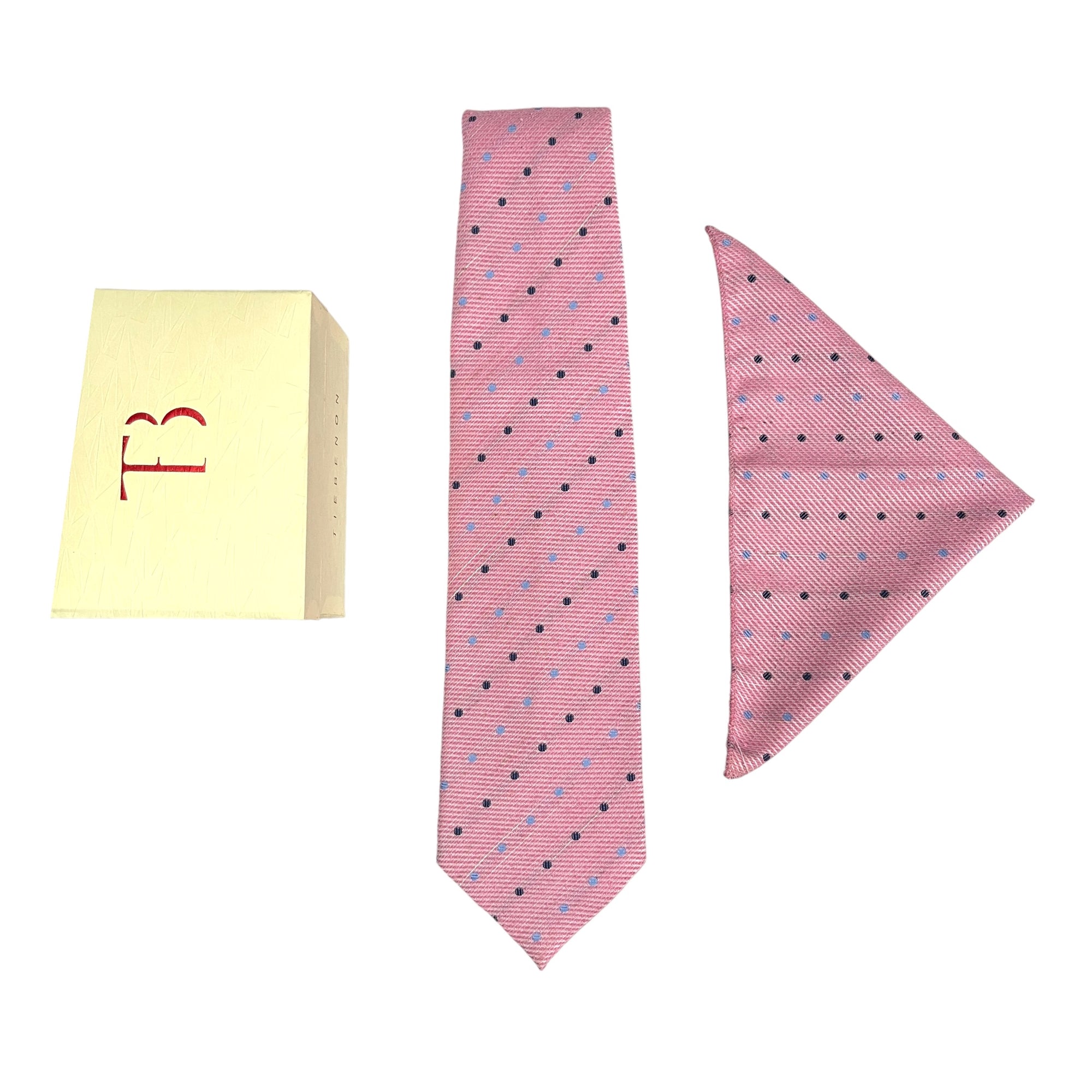 A set of pink dotted broad cashmere ties and a matching pocket square, displayed with a letter T on the tie and a 4-inch marking on the pocket square, indicating the width.