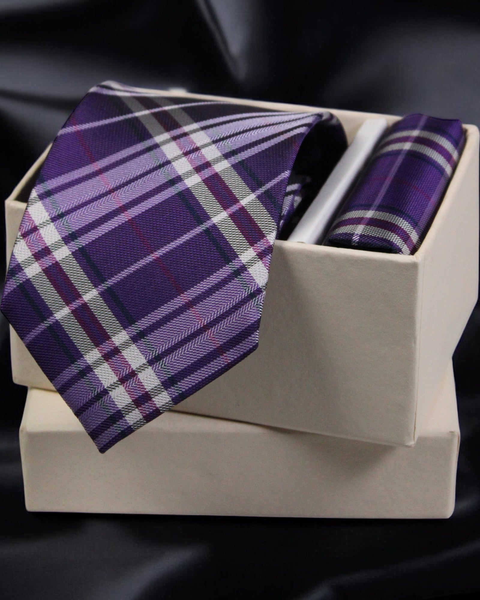 Purple plaid tie and pocket square set in a box on a dark background Tie Benon