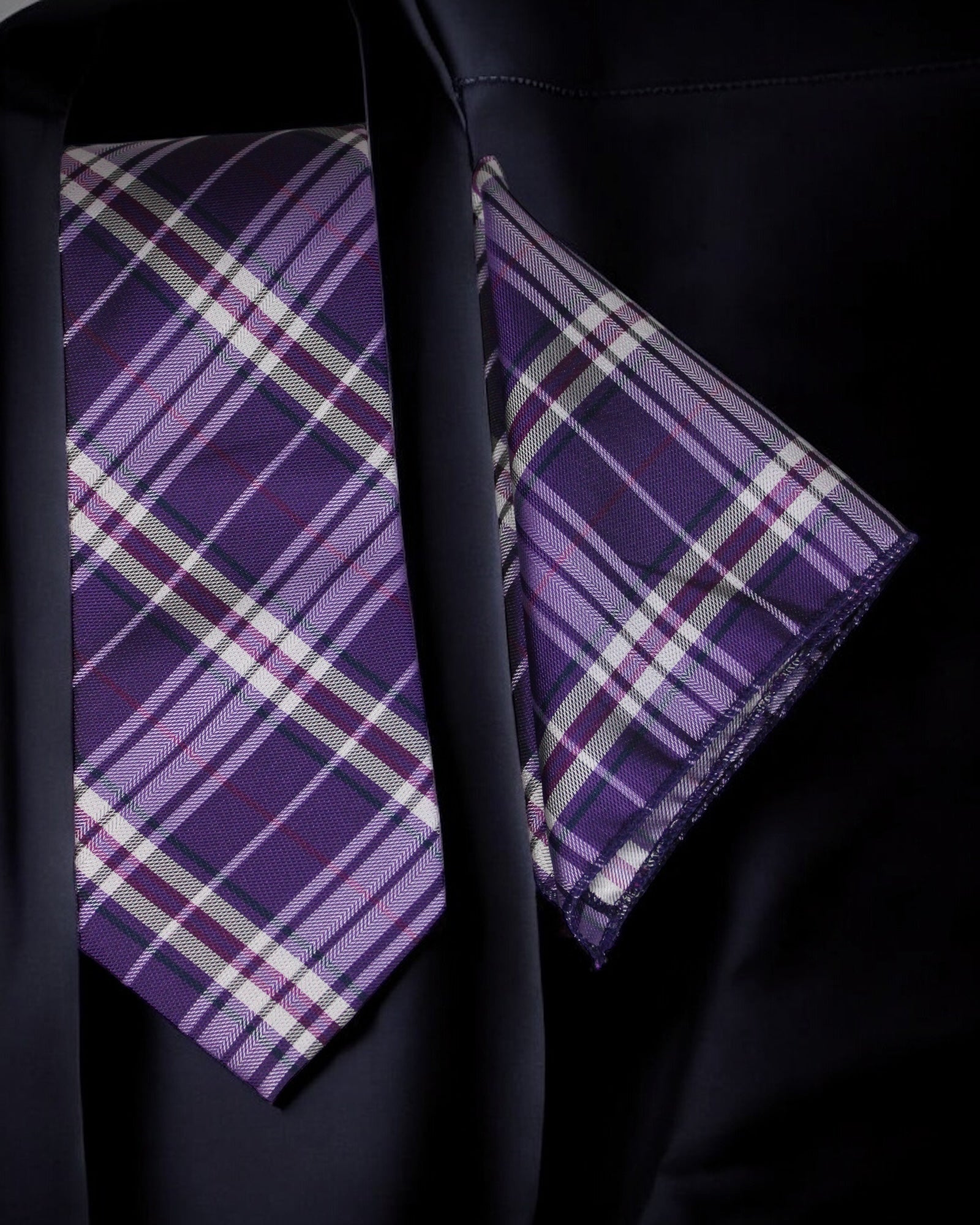 Purple plaid tie and pocket square set on a black shirt tie benon