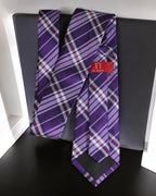 Purple plaid tie with a red label on a black surface Tie Benon