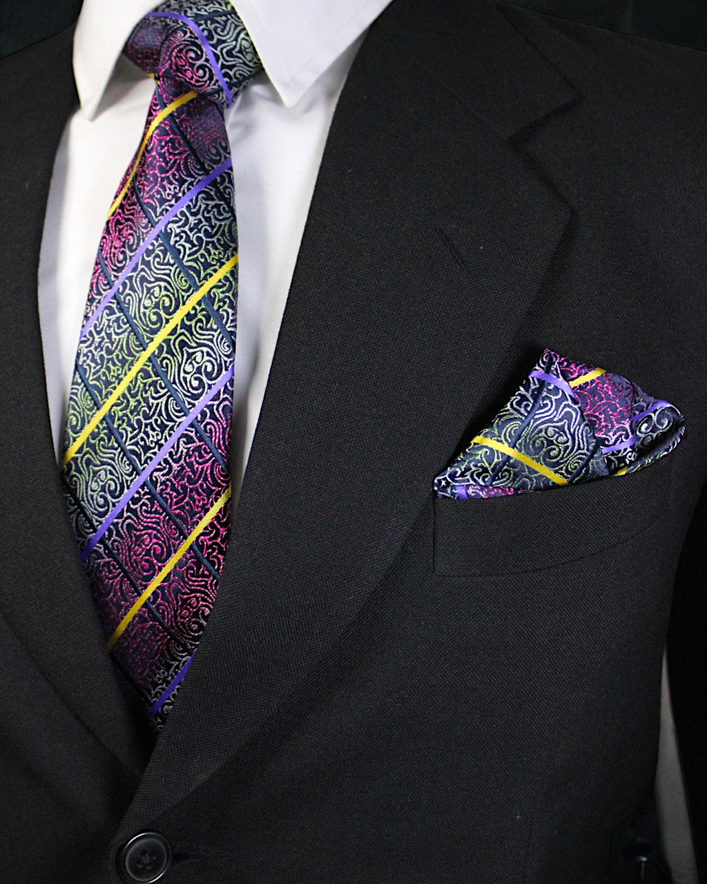 Black suit with a colorful paisley tie and pocket square Tie Benon