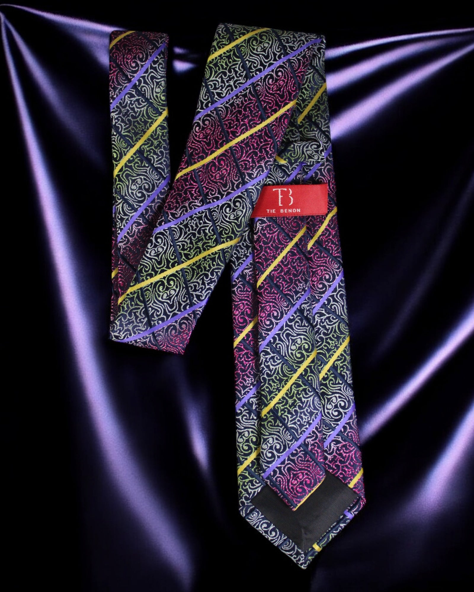 Colorful patterned tie with a brand logo on a dark fabric background Tie Benon