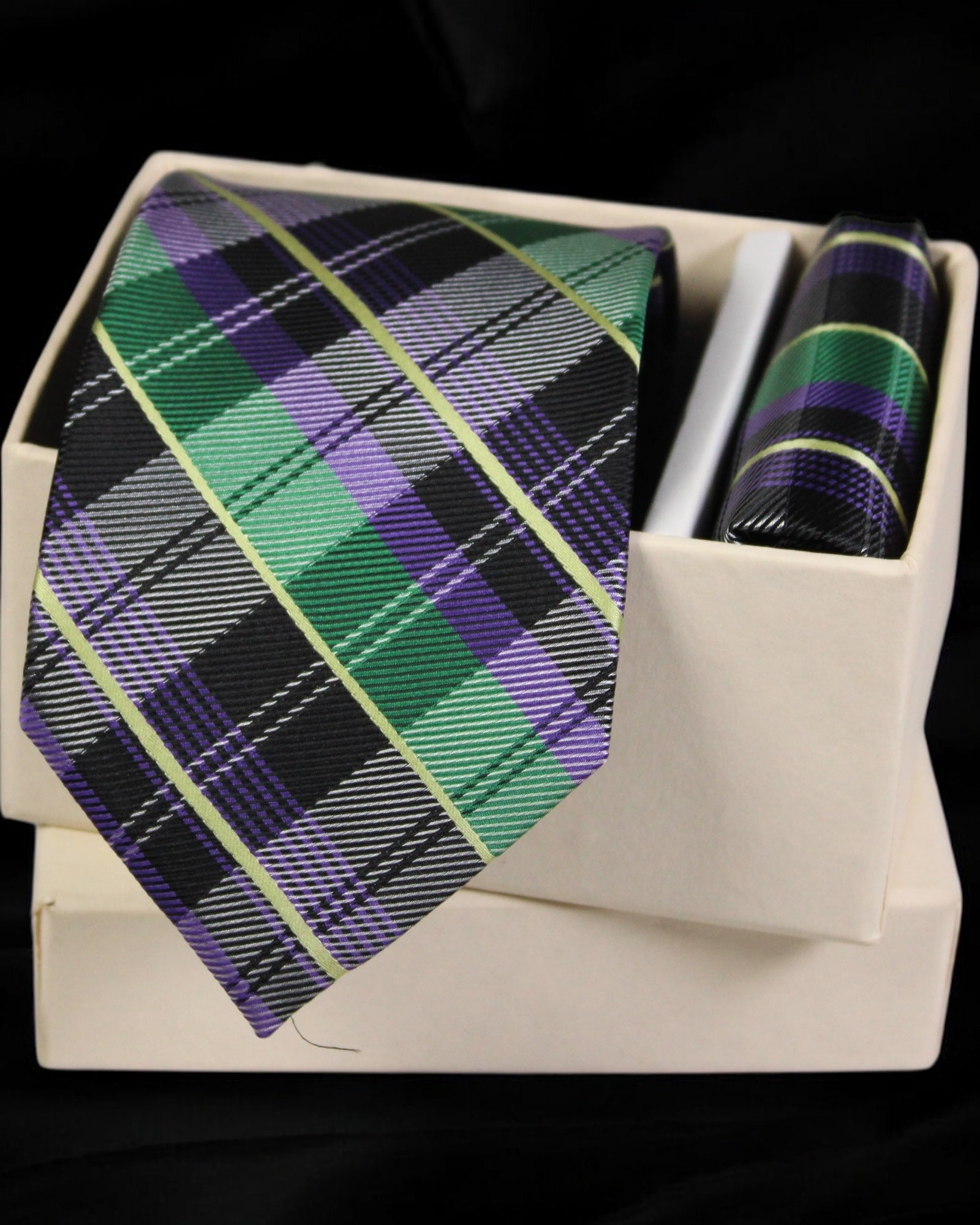 Plaid tie and pocket square set in a white box on a black background Tie Benon