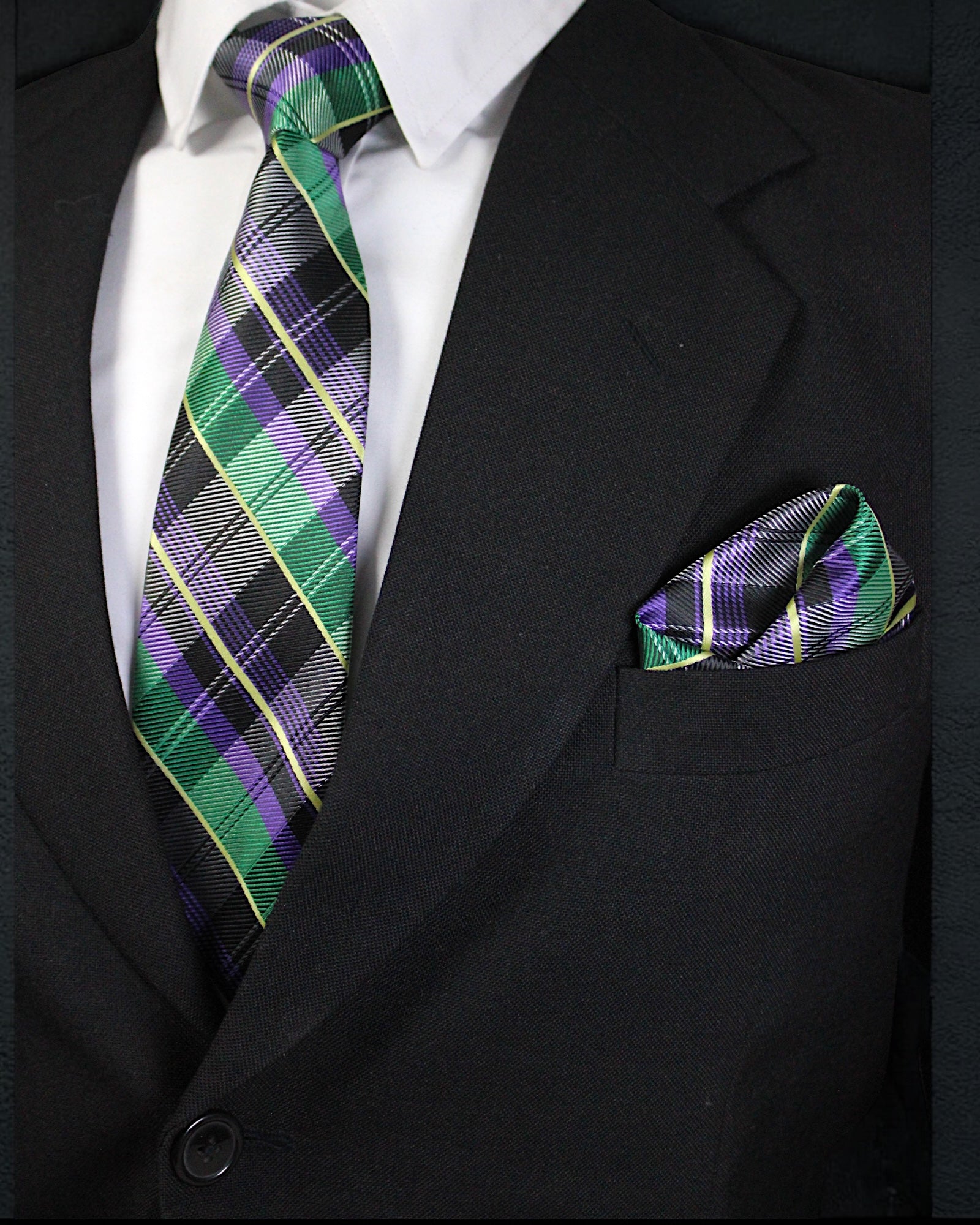 Black suit with a plaid tie and pocket square on a white background Tie Benon