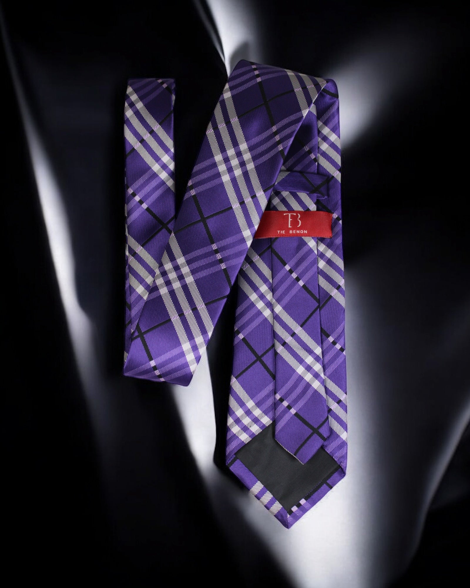 Purple plaid tie with a red tag on a dark background Tie Benon