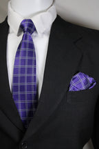 Close-up of a purple plaid tie and pocket square on a black suit jacket Tie Benon