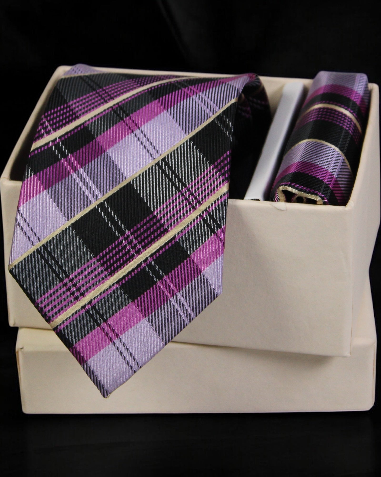 Plaid tie and pocket square set in a box with a black background Tie Benon