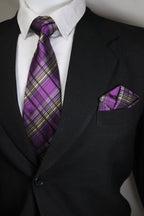 Purple plaid tie on a black suit with a white shirt