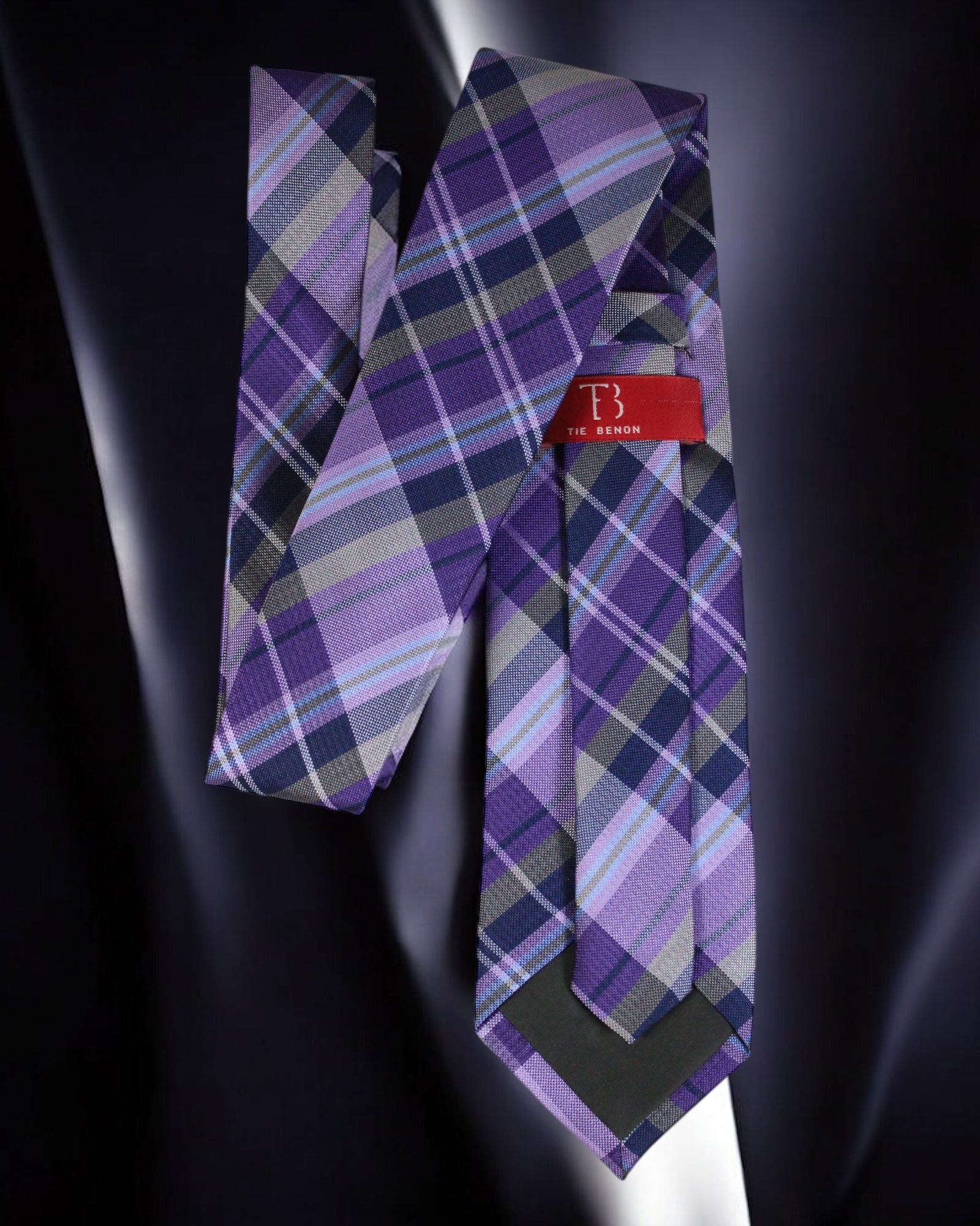 Purple plaid tie with a red label on a dark background Tie Benon