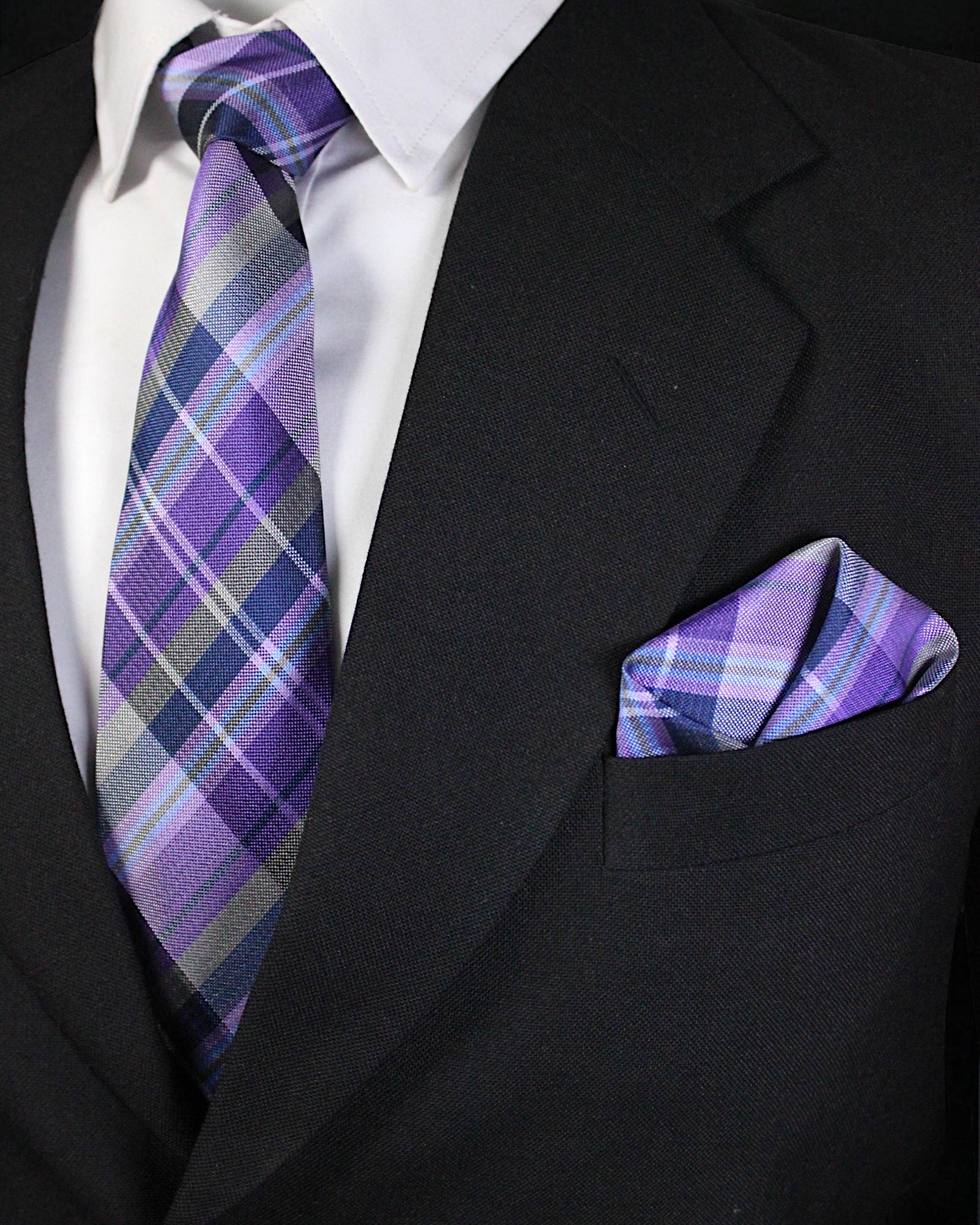 Black suit with a purple plaid tie and pocket square Tie Benon