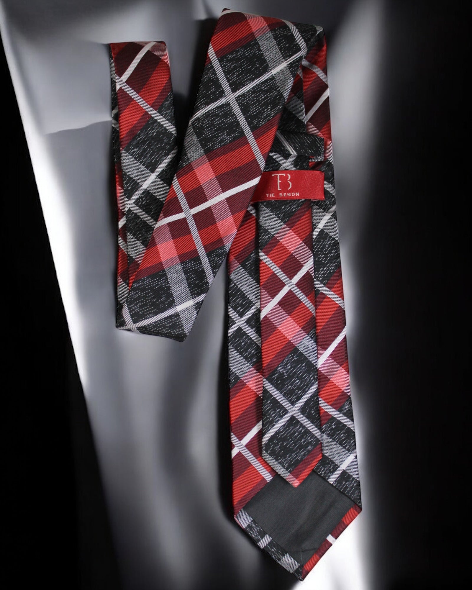 Plaid tie with red, black, and gray pattern on a white background Tie Benon