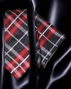 Red, black, and gray plaid tie and pocket square on a dark fabric background Tie Benon