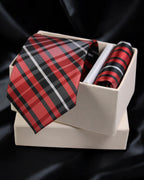 Red and black plaid tie and pocket square set in a white box on a black background Tie Benon
