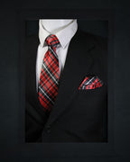 Black suit with a red and black plaid tie and pocket square on a dark background Tie Benon