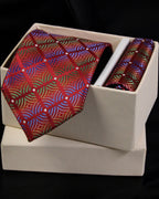Colorful patterned tie and matching pocket square in a white box on a black background Tie Benon