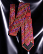 Red patterned tie on a reflective black surface Tie Benon