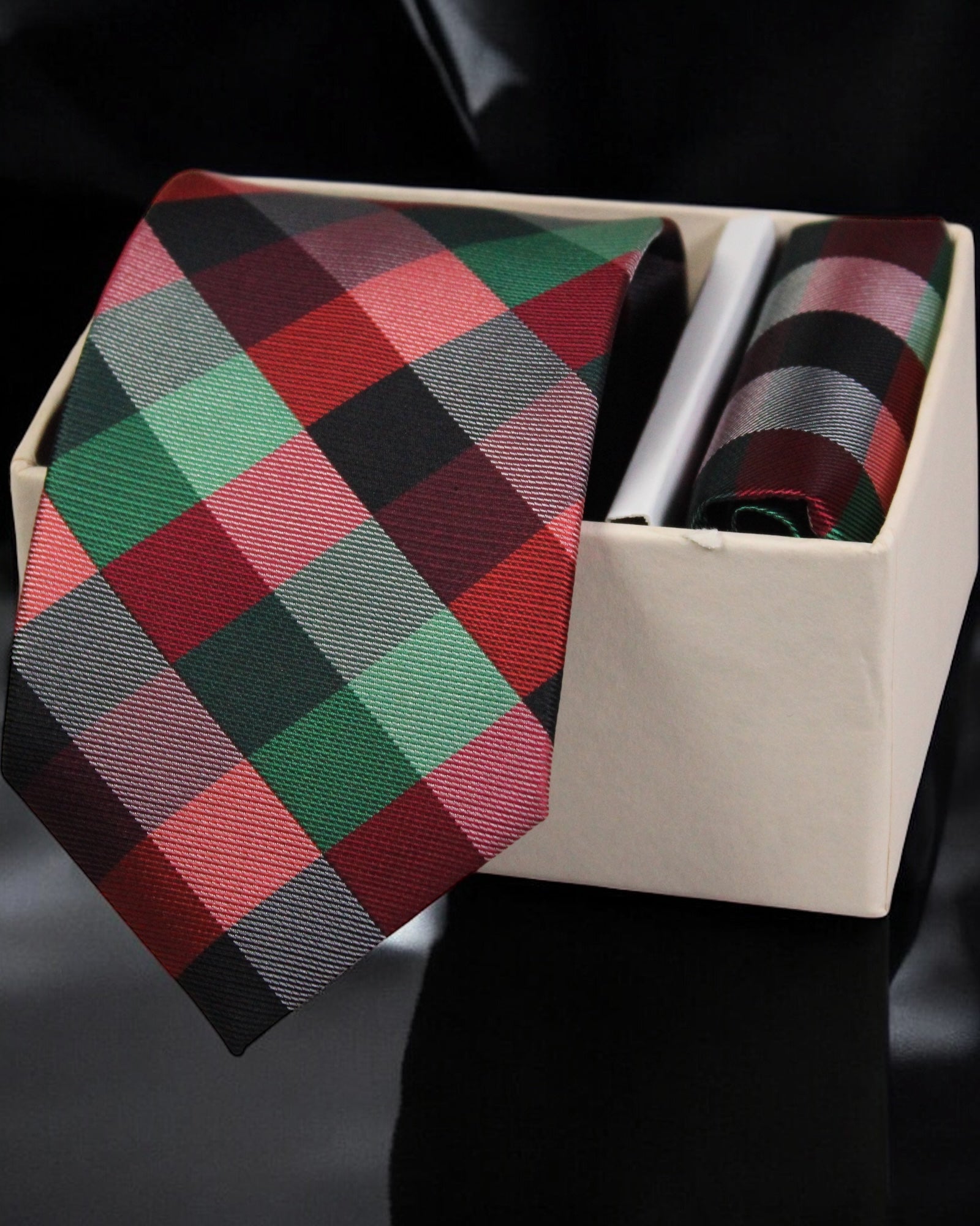 Plaid tie in a box with a black background Tie Benon