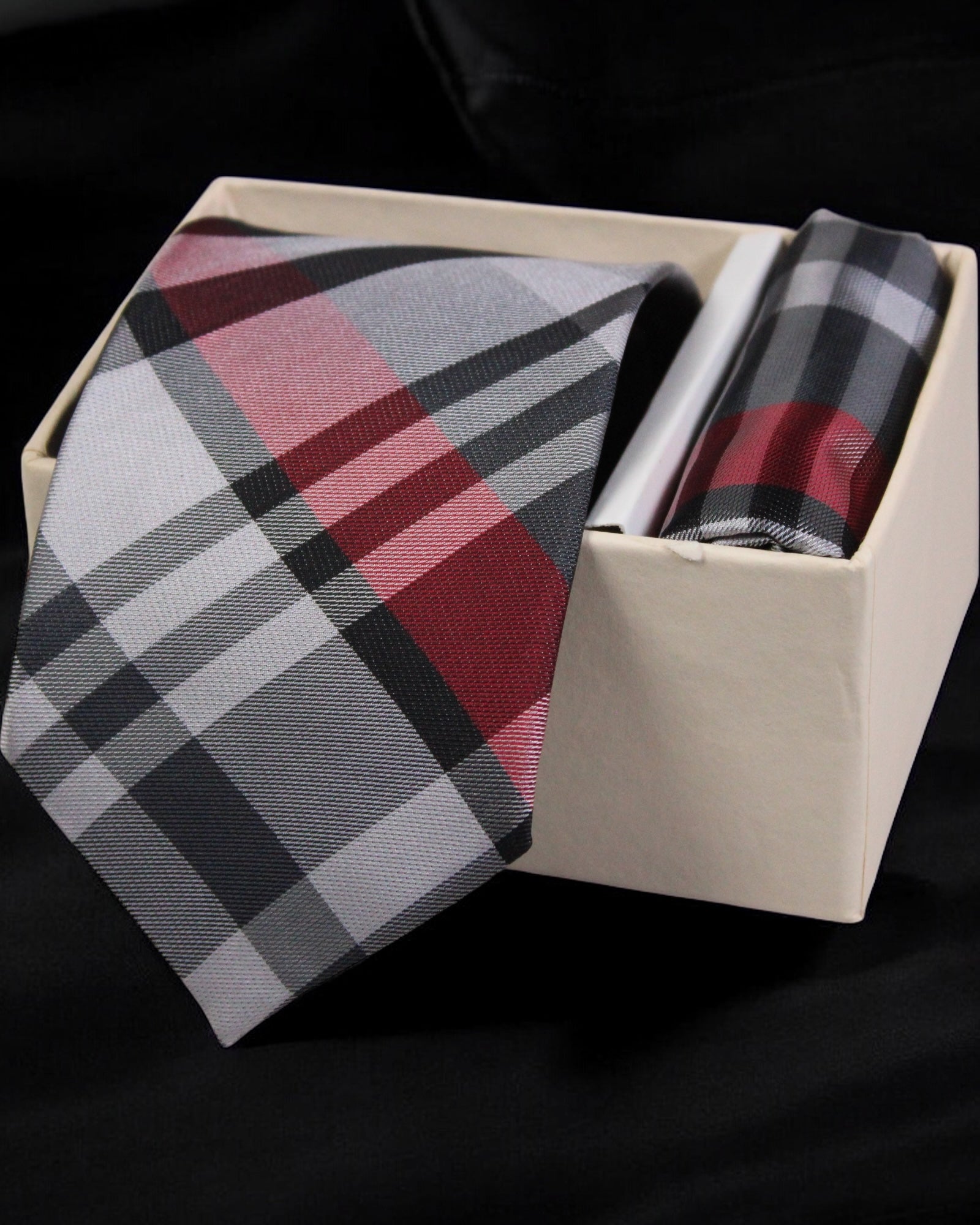 Plaid tie and pocket square set in a box on a black background Tie Benon