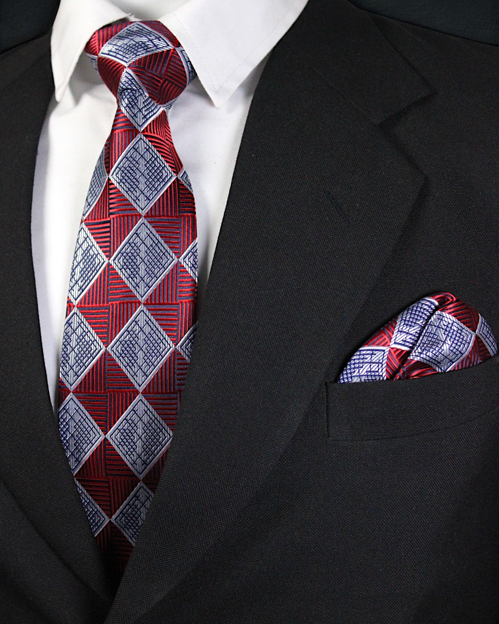 Red and blue checkered tie and pocket square on a black suit jacket Tie Benon