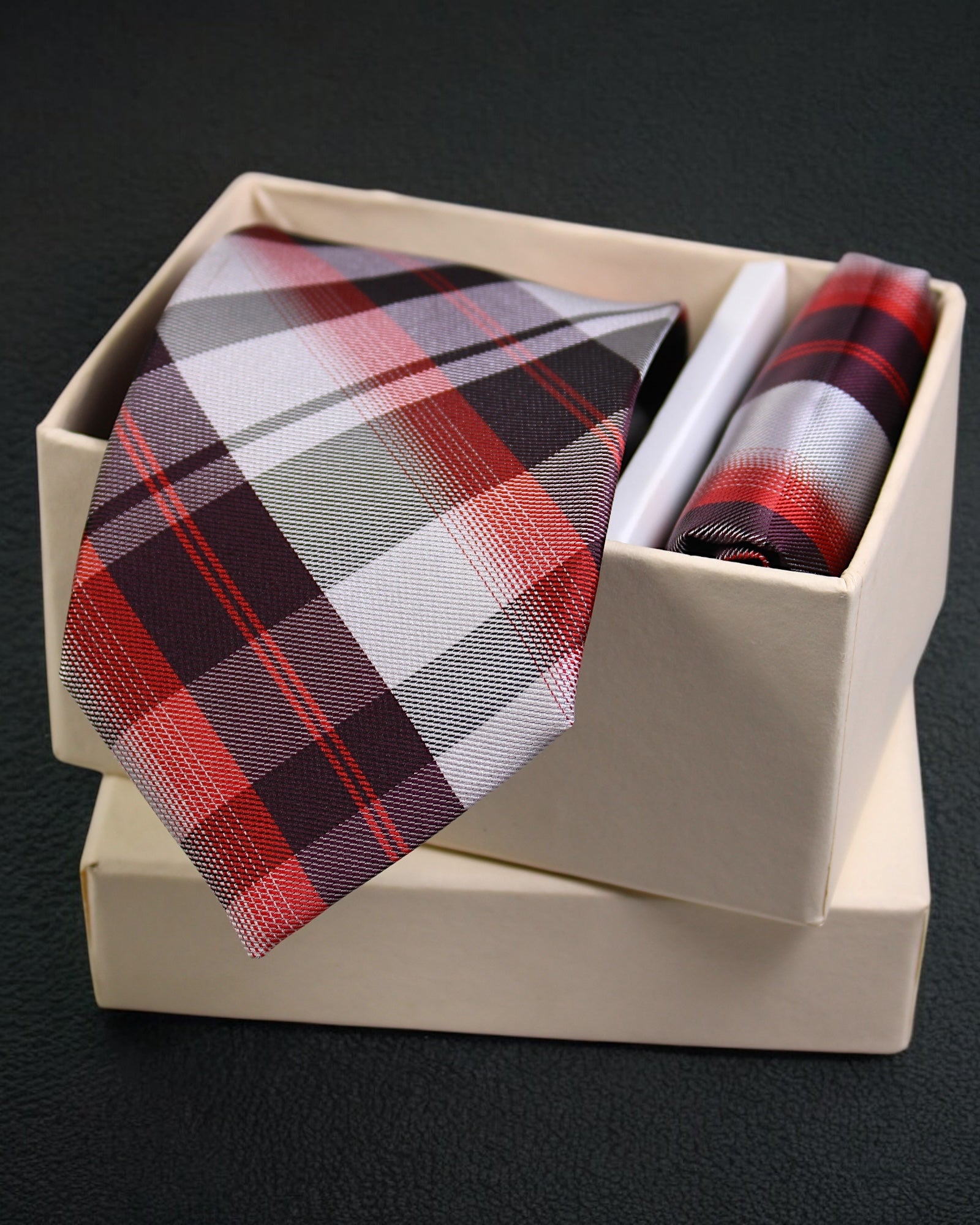 Plaid tie and pocket square set in a box on a dark background Tie Benon