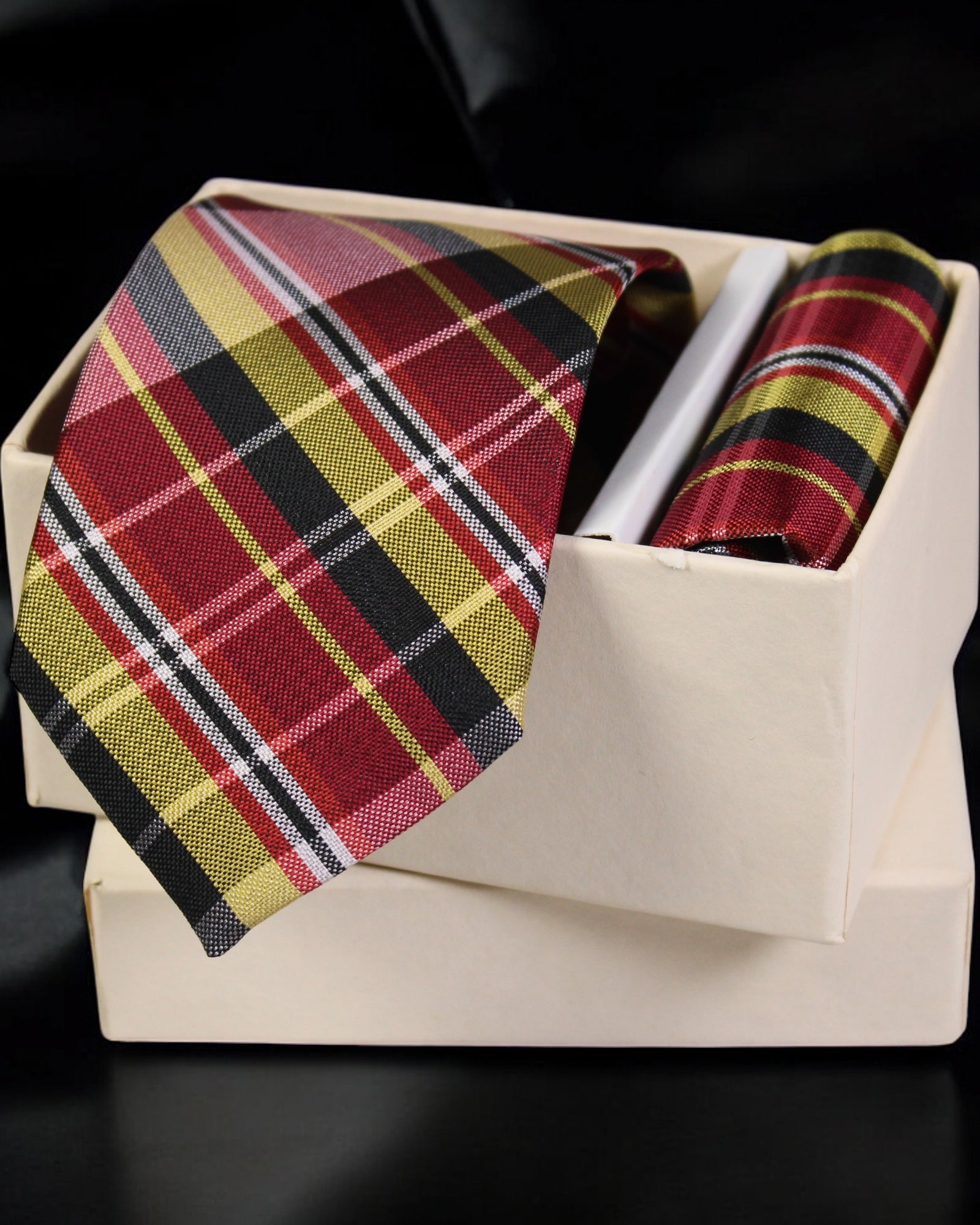 Plaid tie and pocket square set in a box on a black background Tie Benon