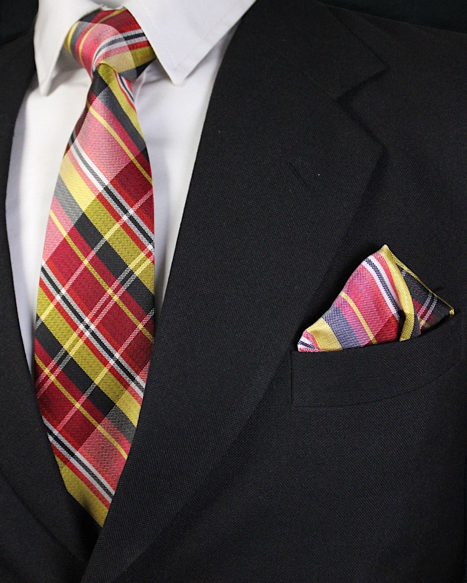 Black suit with a colorful plaid tie and pocket square Tie Benon