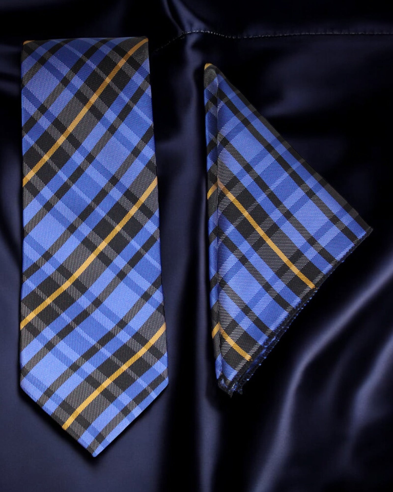 Blue and black plaid tie and pocket square on a dark satin background Tie Benon