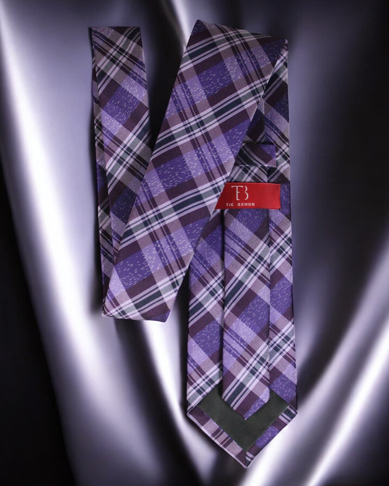 Plaid tie with a red label on a metallic surface Tie Benon