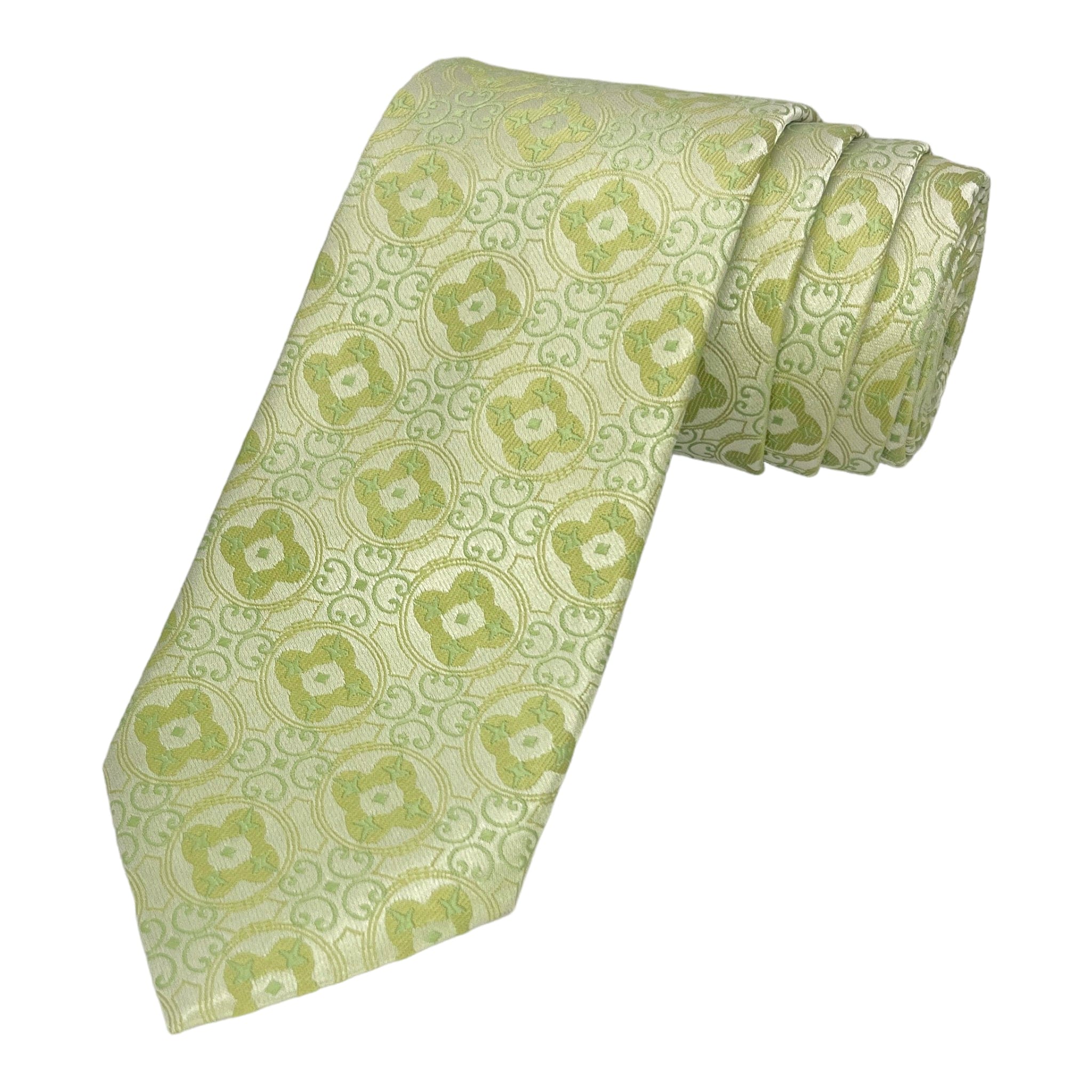 A sage green microsilk tie with an intricate geometric pattern, rolled up with a matching pocket square.