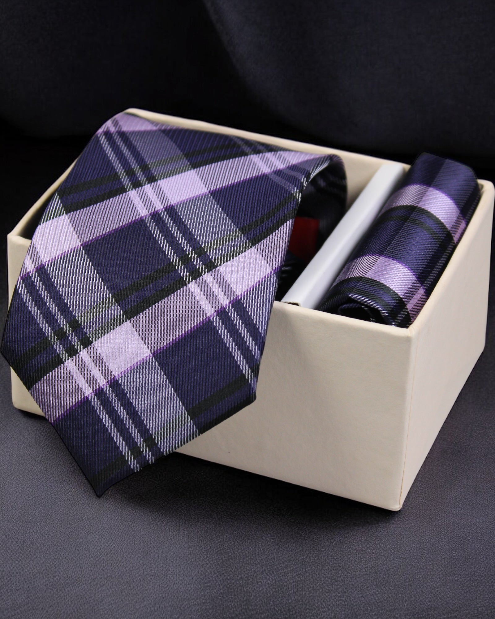 Plaid purple tie and pocket square set in a box on a dark background Tie Benon