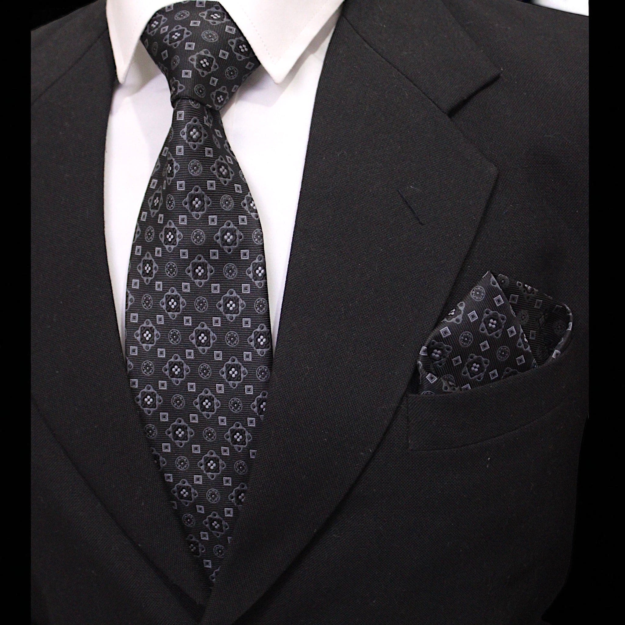 Formal black geometric tie set styled for business and wedding wear