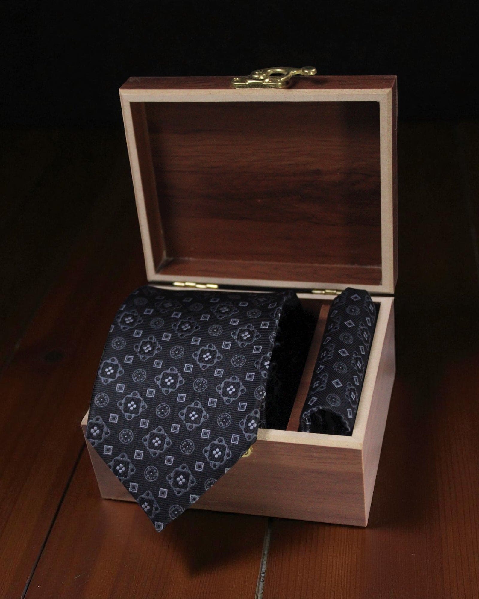 Black geometric microsilk necktie with matching pocket square in wooden gift box