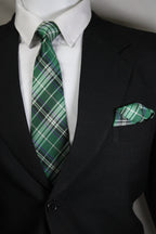 Green plaid tie on a suit with a white shirt