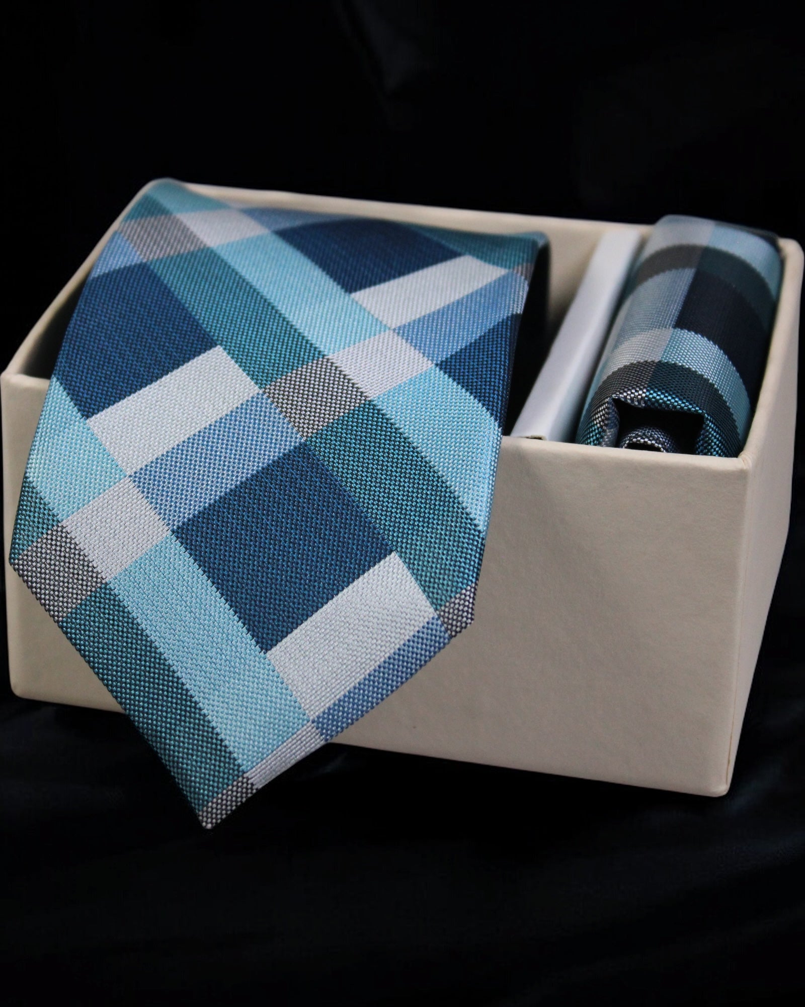 Blue checkered tie and pocket square set in a box on a black background tie  Benon