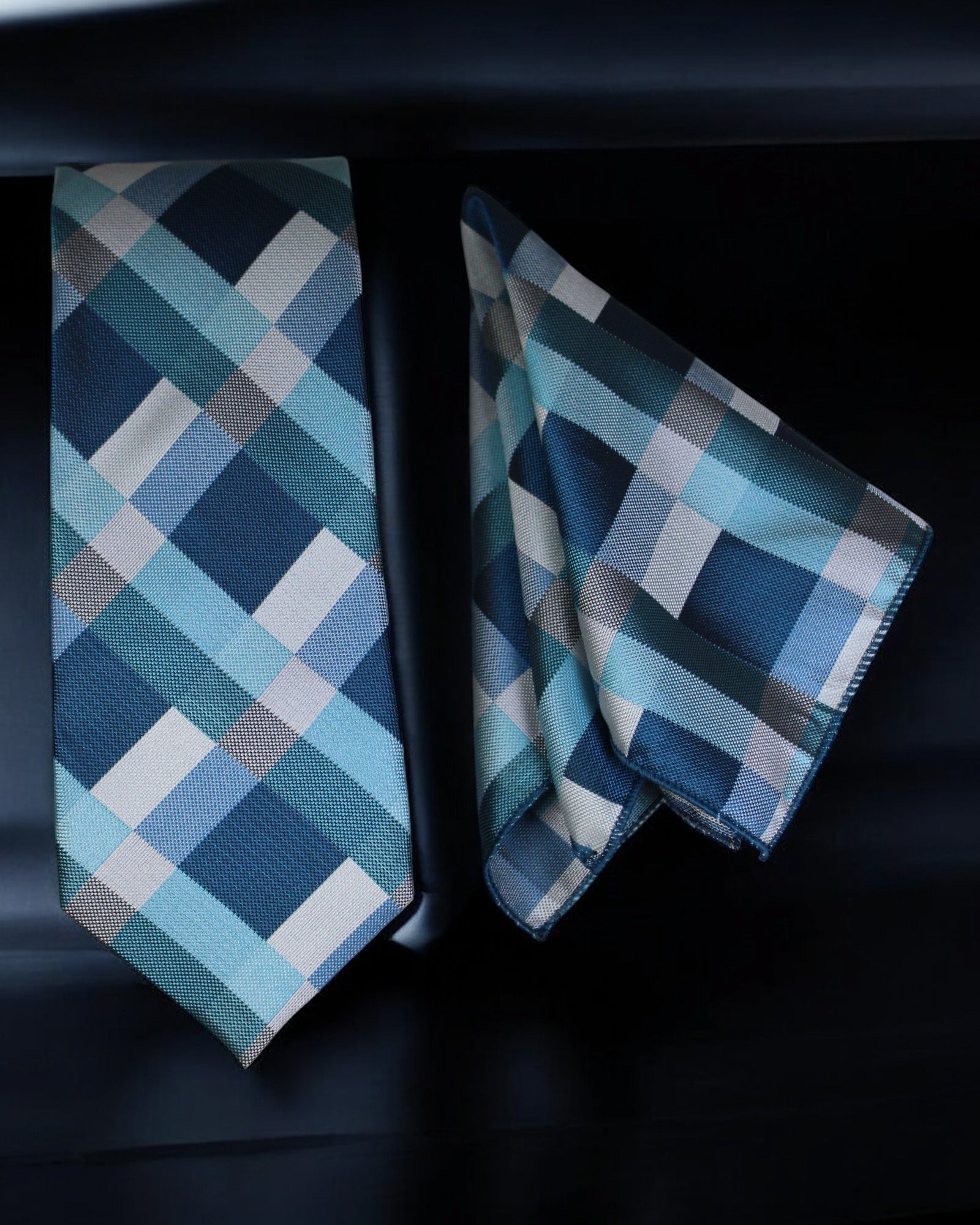 Blue plaid tie and matching pocket square on a dark background Tie Benon