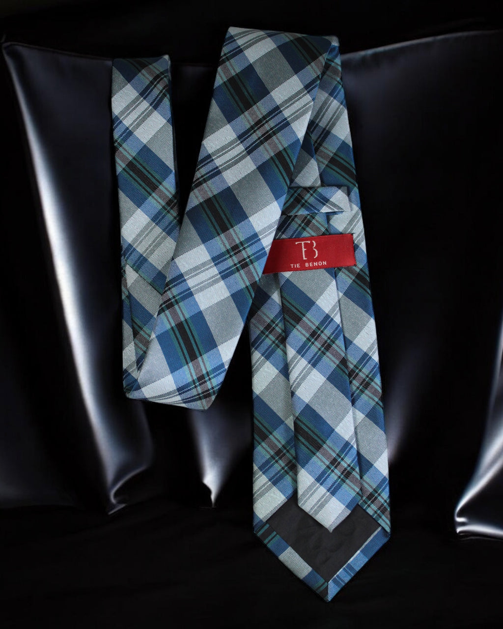 Blue plaid tie with a red label on a black background Tie Benon