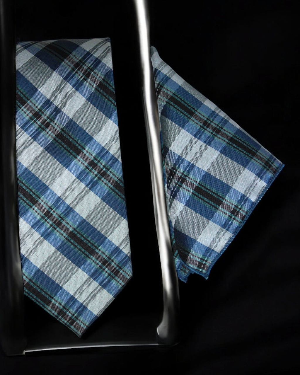 Plaid tie and pocket square with a metal cane on a black background Tie Benon