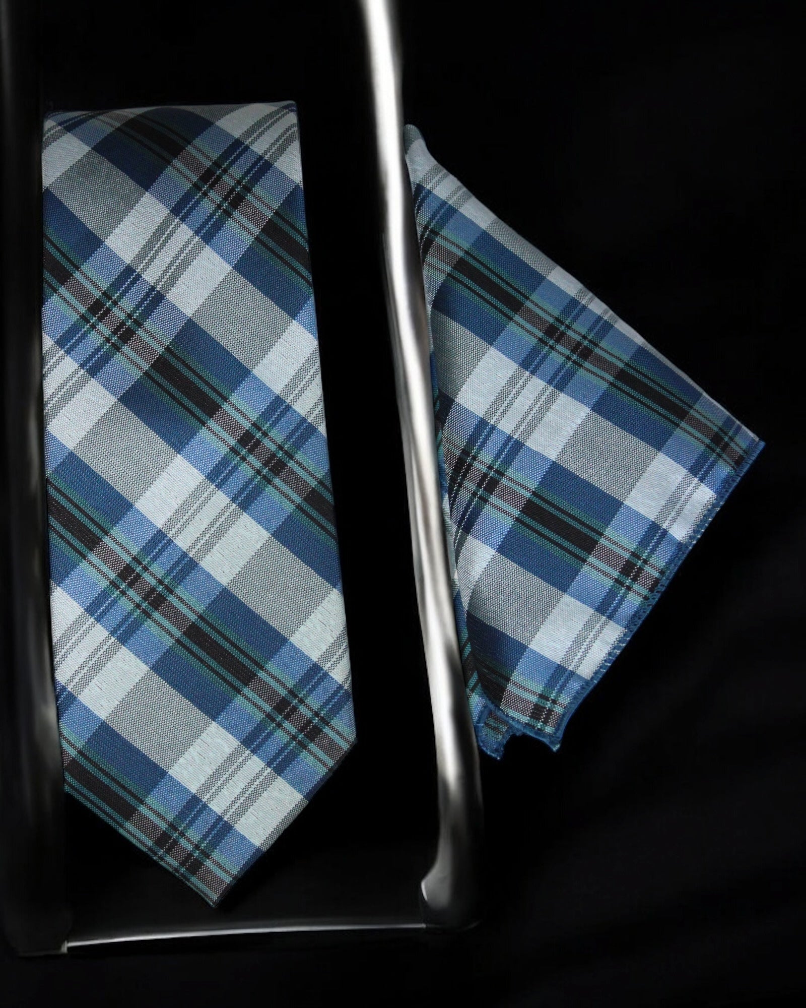 Plaid tie and pocket square with a metal cane on a black background Tie Benon