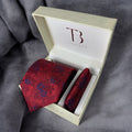 A Tie Benon branded microfiber red floral tie with a pocket square, presented in an open white box with gold interior.