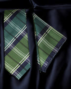Green plaid tie on a black shirt Tie Benon