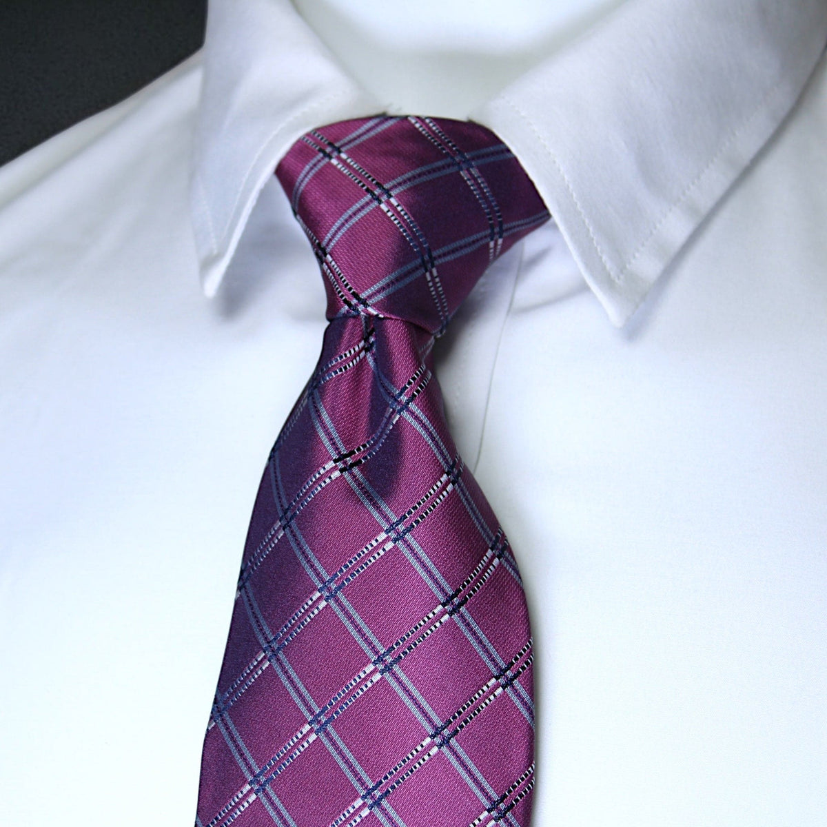 Purple plaid tie on a white shirt