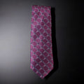 Pink checkered tie on a dark gray background
