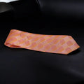 Pink checkered tie on a black background