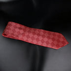 Red checkered tie on a black background