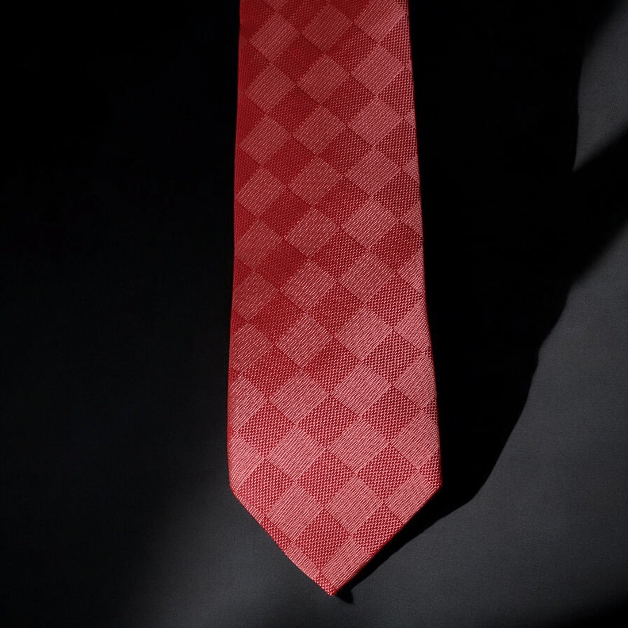Red checkered tie on a black background