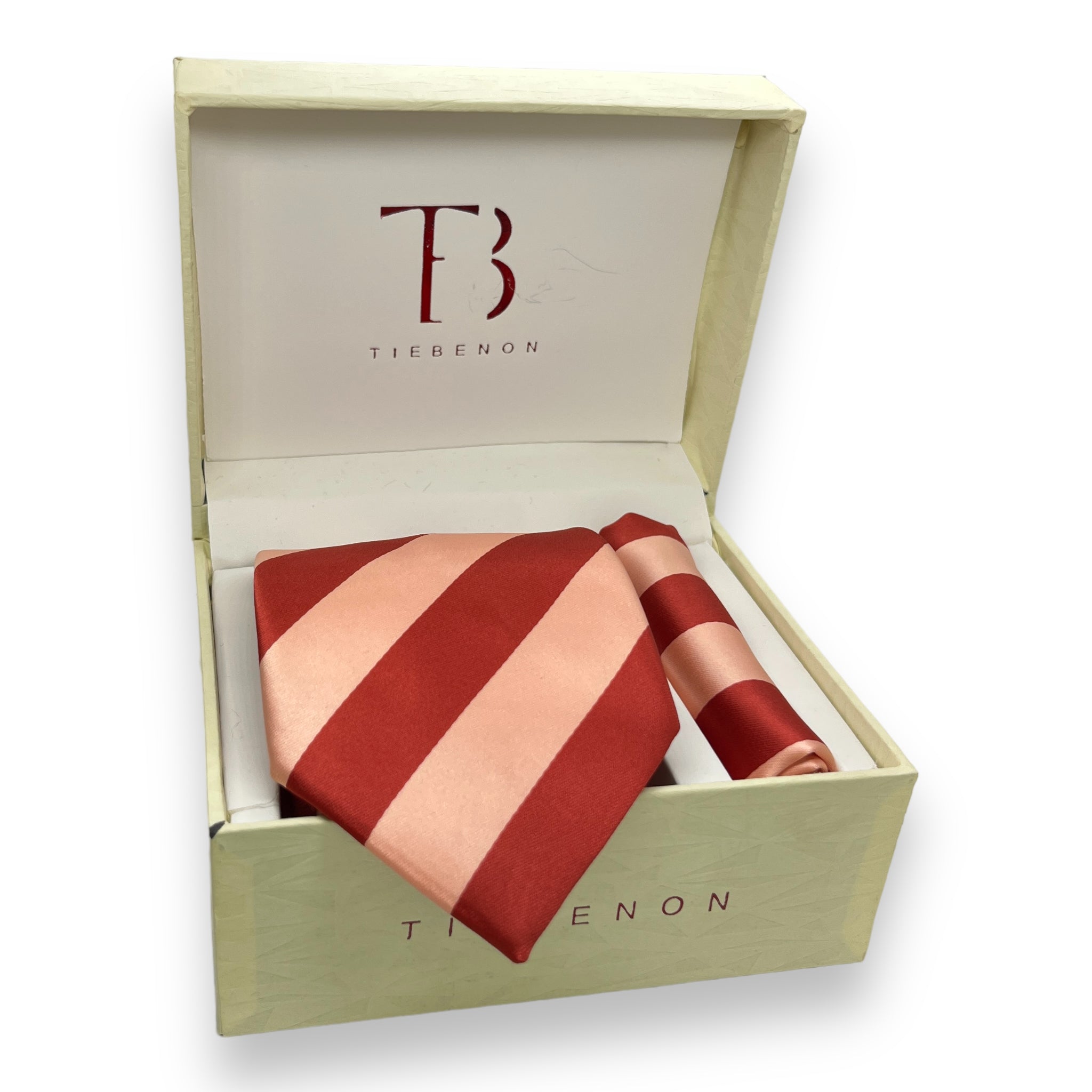 A striped necktie with peach and rust colors, presented in an open wooden box with the brand 'Tie Benon' visible on the interior lid.