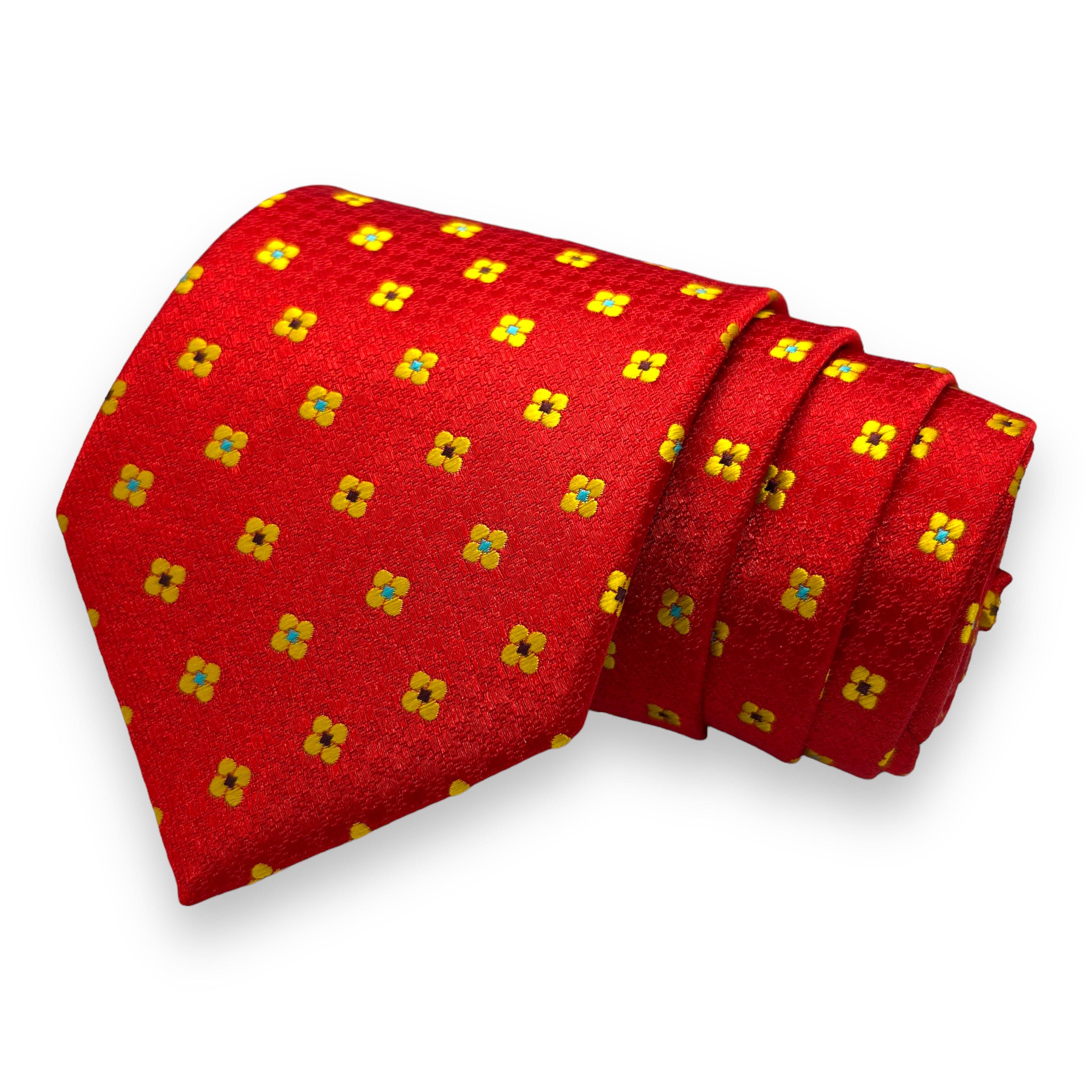 A red necktie with a yellow floral pattern.